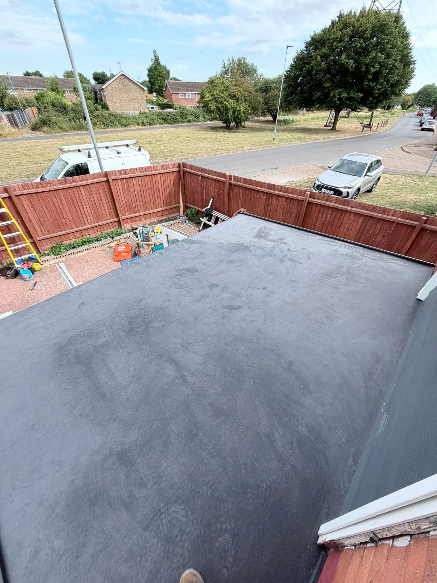 Finished black EPDM flat roof on conservatory conversion